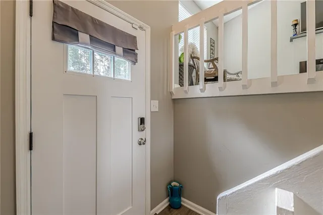 a view of bathroom with mirror and window