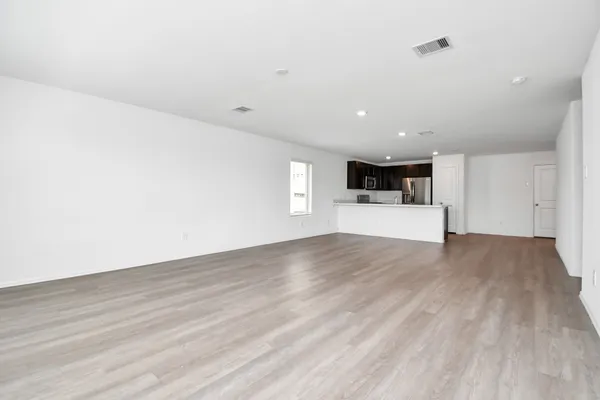 a view of a kitchen with a sink and a stove top oven