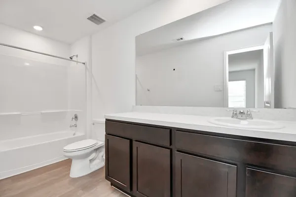 a kitchen with granite countertop stainless steel appliances a refrigerator and a sink