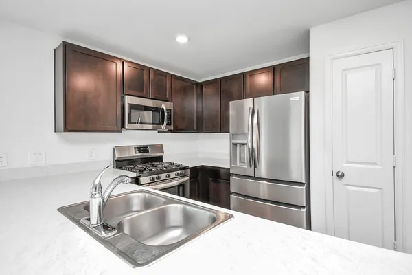 a view of kitchen with microwave and window