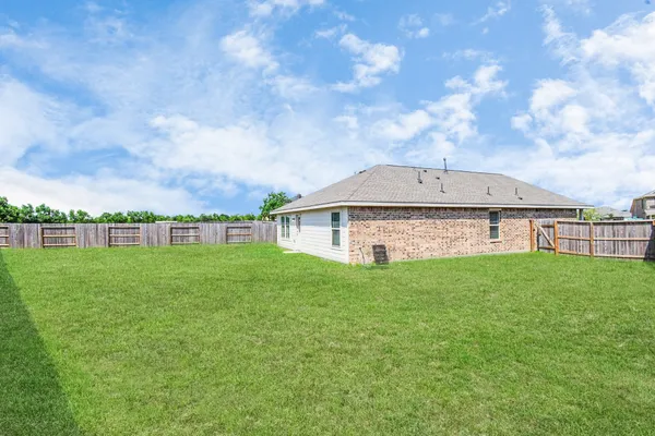 a view of backyard with green space