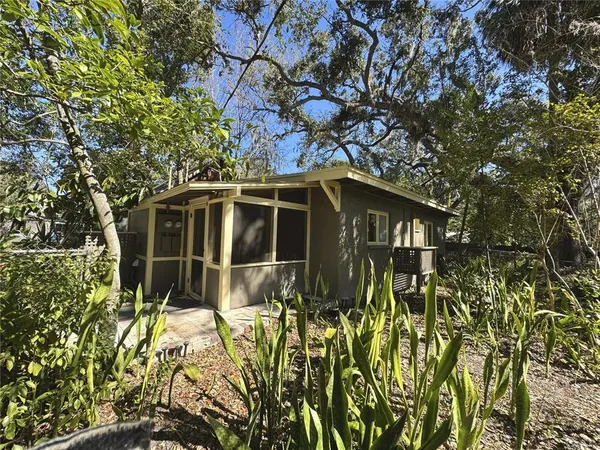 a house with trees in front of it