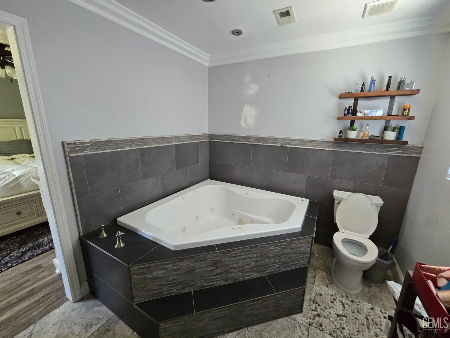 Undisclosed Address Bakersfield, CA 93309 - Photo 11 of 14 a bathroom with a sink a toilet and a mirror