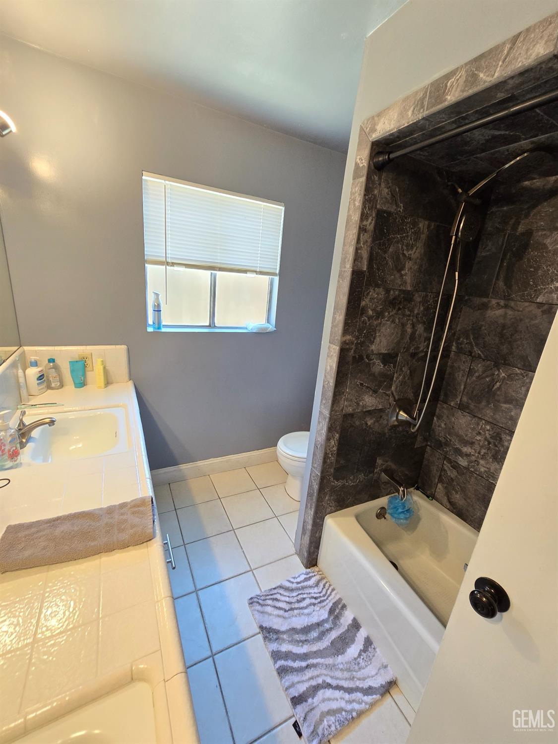 Undisclosed Address Bakersfield, CA 93309 - Photo 12 of 14 a bathroom with a sink and a mirror