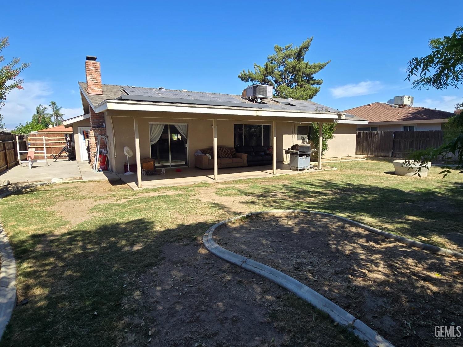 Undisclosed Address Bakersfield, CA 93309 - Photo 14 of 14 a view of a house with a yard