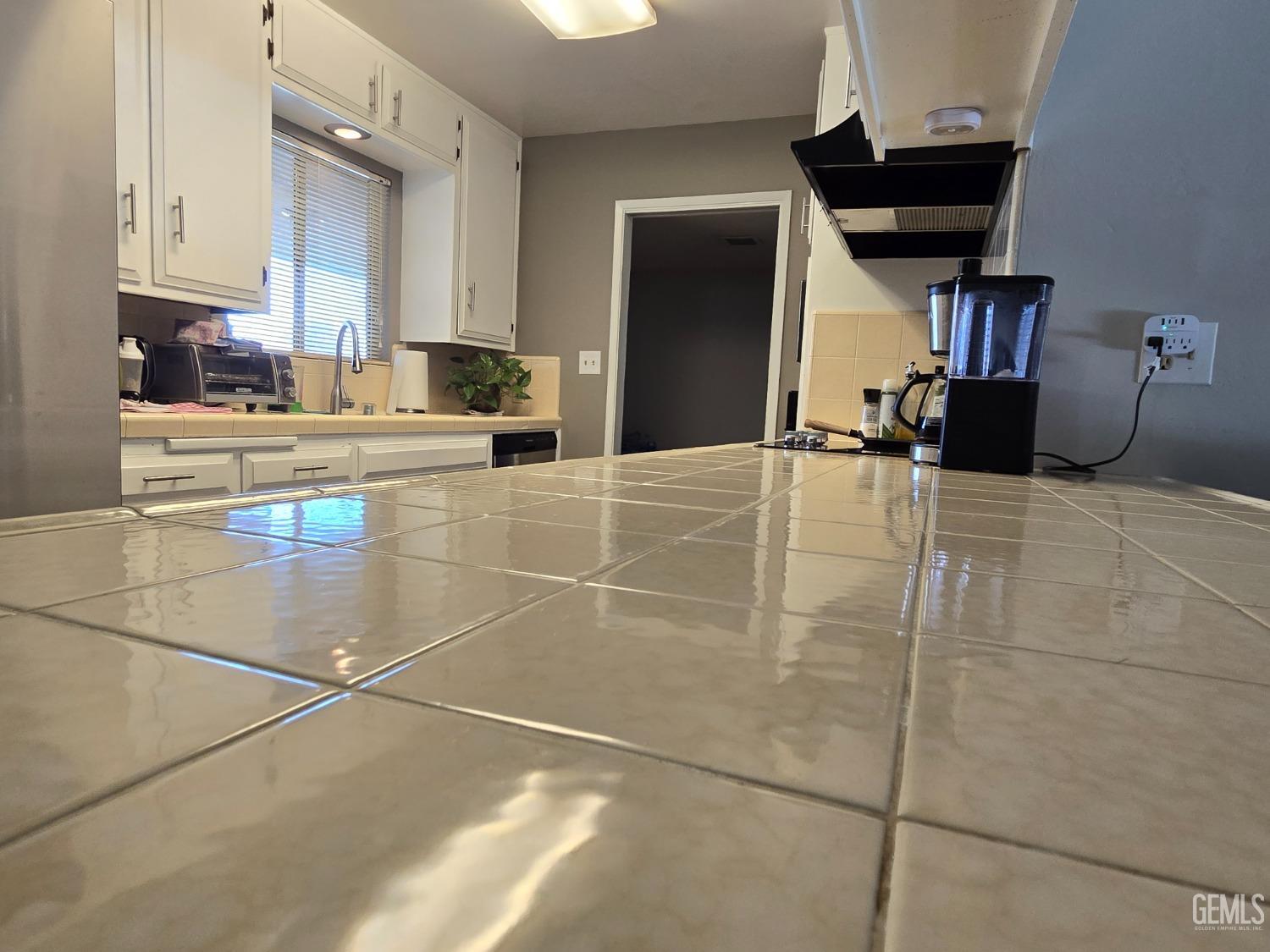 Undisclosed Address Bakersfield, CA 93309 - Photo 3 of 14 a kitchen with stainless steel appliances a stove a sink and a refrigerator