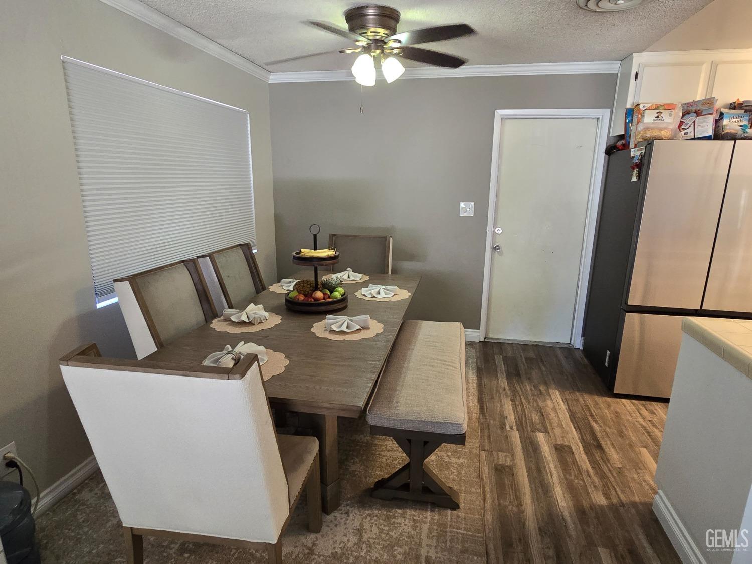 Undisclosed Address Bakersfield, CA 93309 - Photo 5 of 14 a view of a dining room with furniture