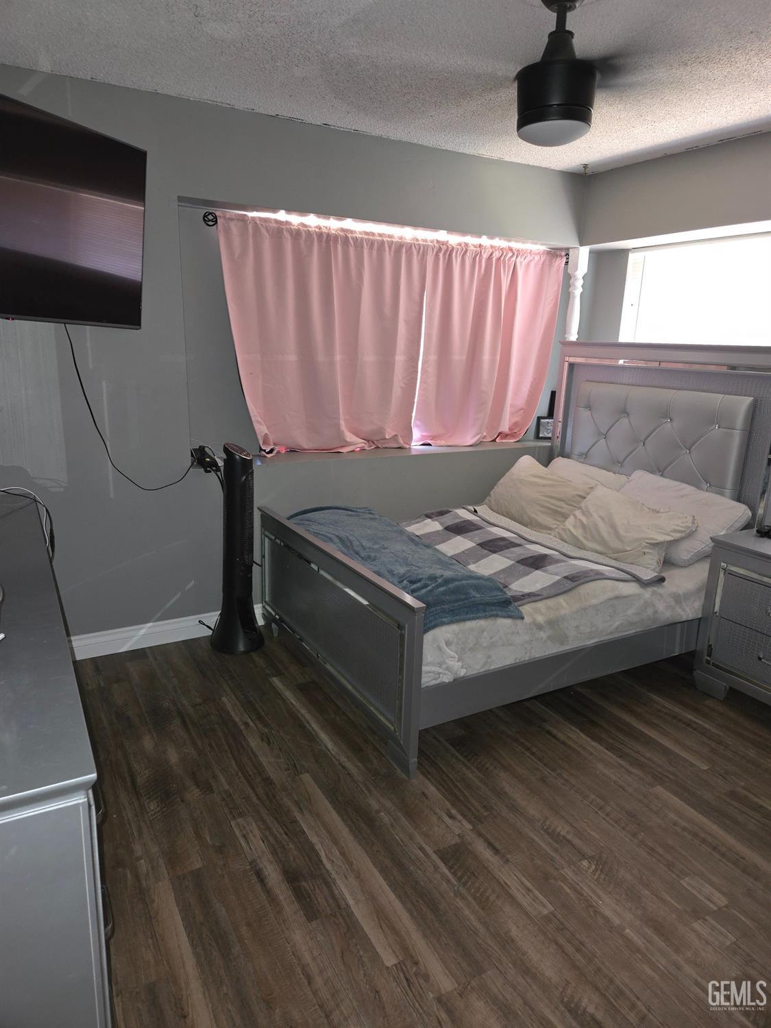 Undisclosed Address Bakersfield, CA 93309 - Photo 9 of 14 a bed sitting in a bedroom next to a window