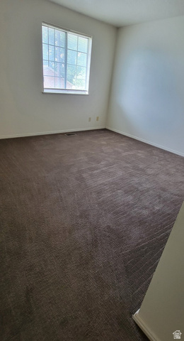 190 West 700 North Logan, UT 84321 - Photo 46 of 51 Empty room with baseboards and dark colored carpet