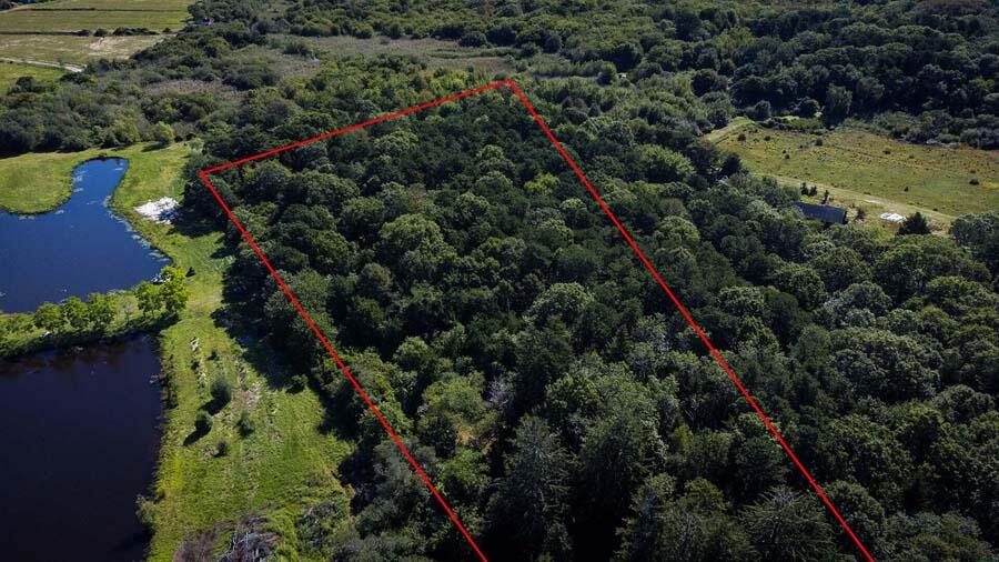 38 Roos Road East Sandwich, MA 02537 - Photo 4 of 12 an aerial view of residential house with outdoor space and trees all around