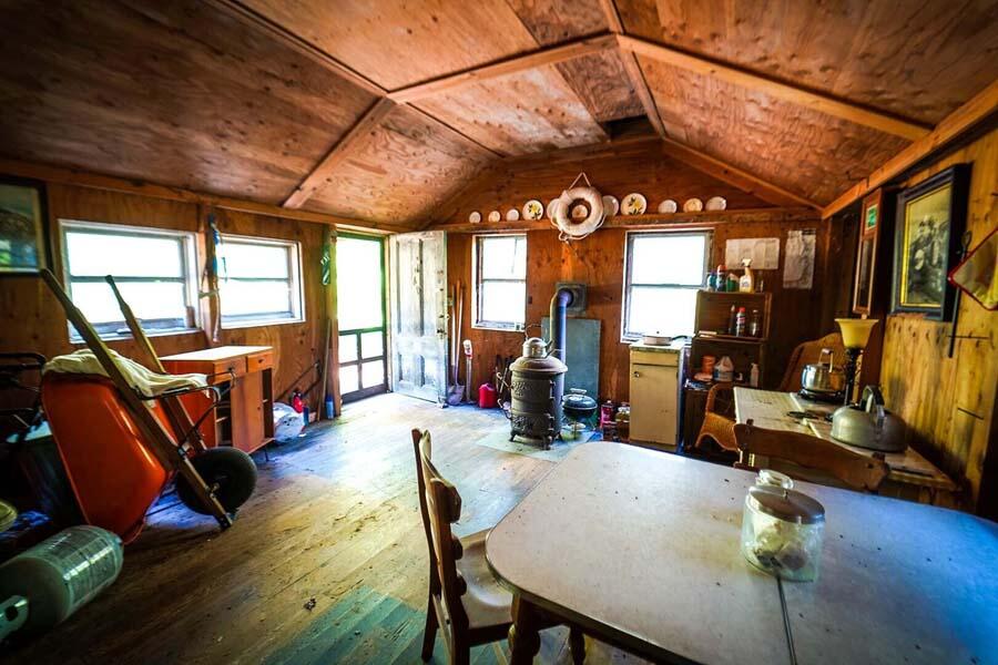 38 Roos Road East Sandwich, MA 02537 - Photo 9 of 12 a view of a dining room with furniture large windows and wooden floor
