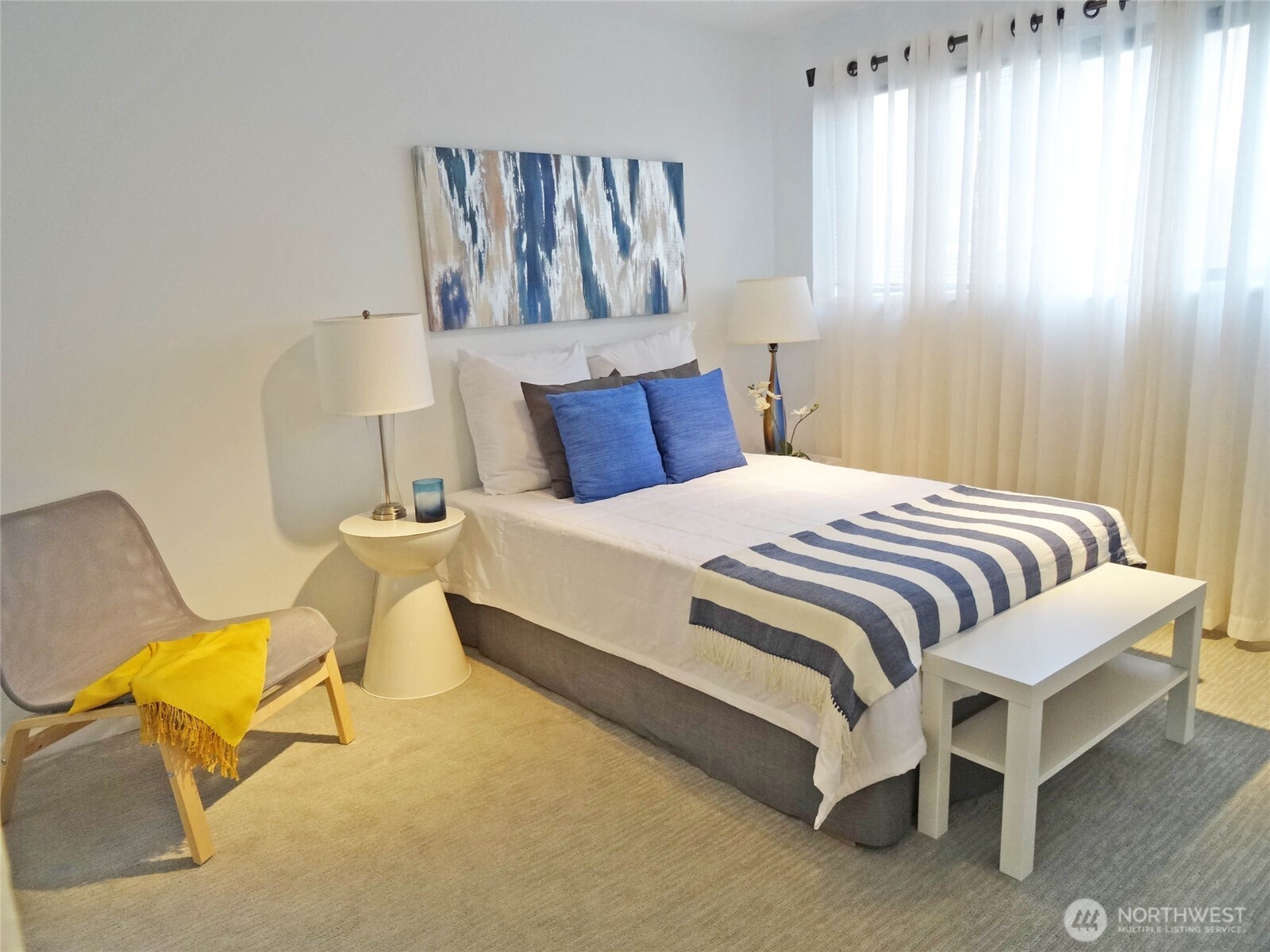 343 4th Avenue, Unit D Kirkland, WA 98033 - Photo 11 of 18 a bedroom with a bed and chair