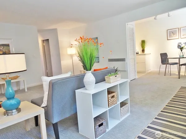 a living room with furniture and a table