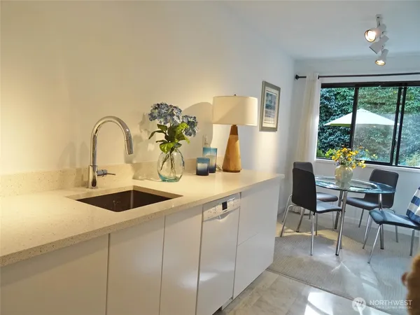 a kitchen with a sink and cabinets
