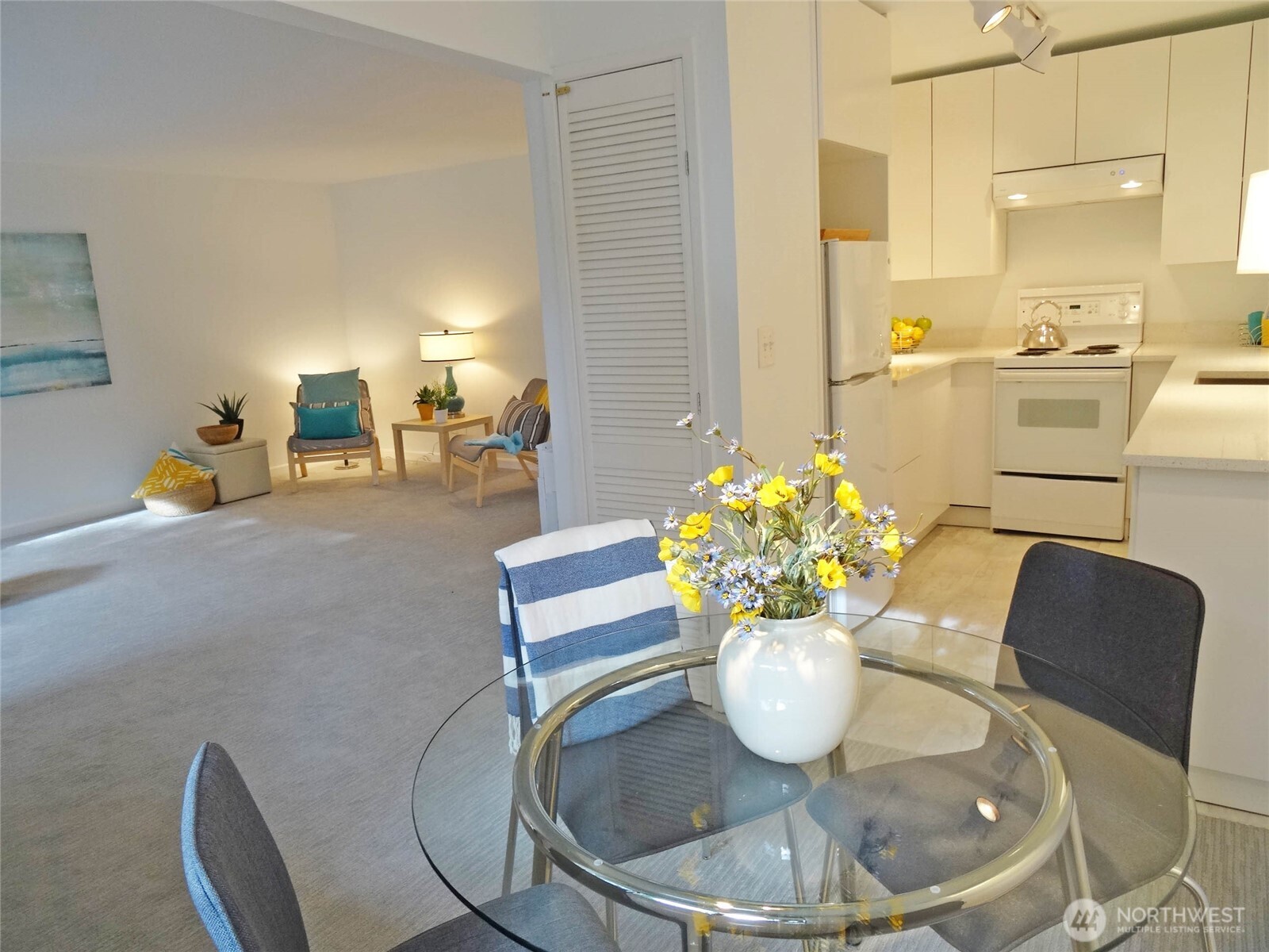 343 4th Avenue, Unit D Kirkland, WA 98033 - Photo 9 of 18 a dining room with furniture and chandelier