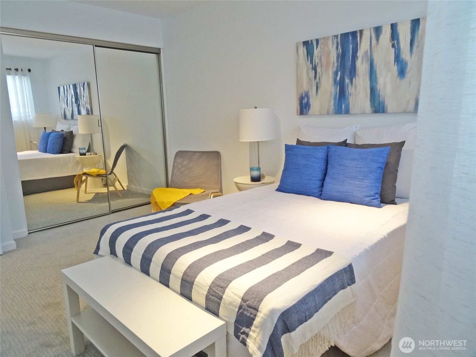 343 4th Avenue, Unit D Kirkland, WA 98033 - Photo 10 of 18 a bedroom with a bed and wall painting