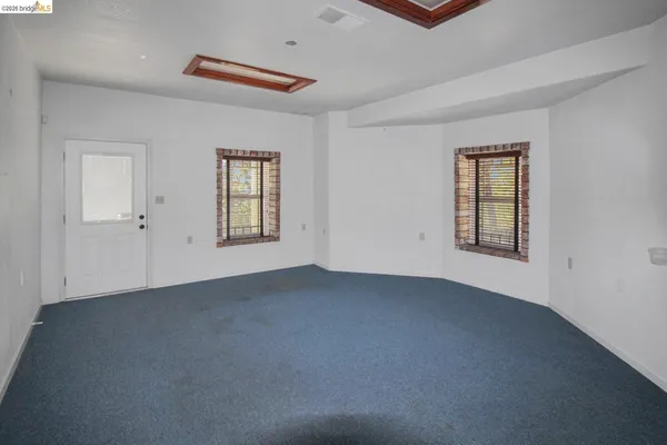 an empty room with windows