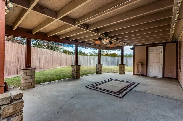 a living room with couch and a large window