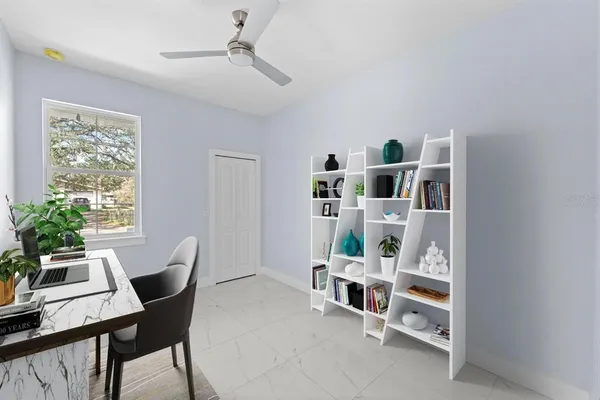 a work room with furniture and windows
