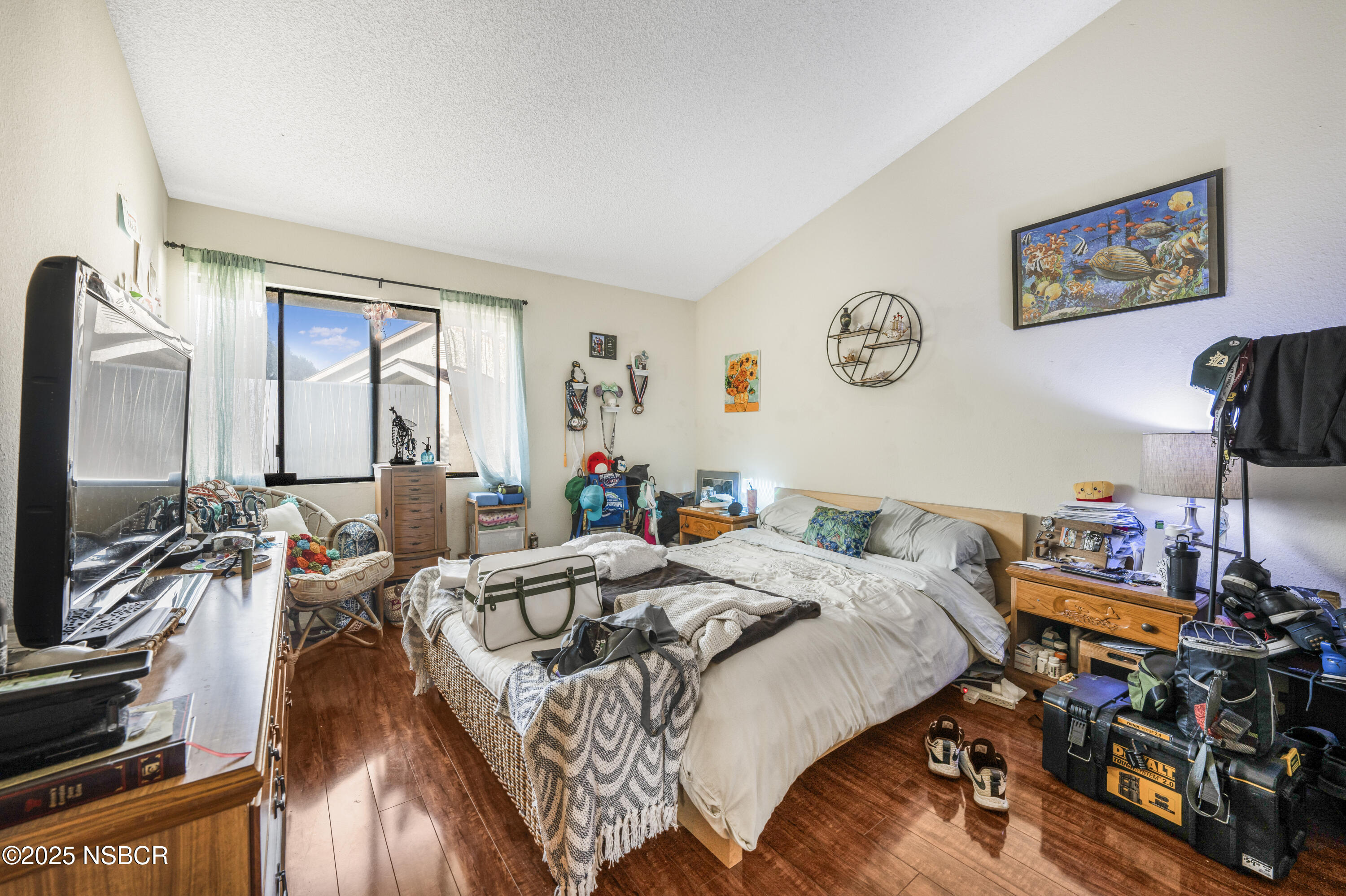 23 Village Cir Drive Lompoc, CA 93436 - Photo 11 of 16 a bed room with a bed a computer on a desk and a book shelf