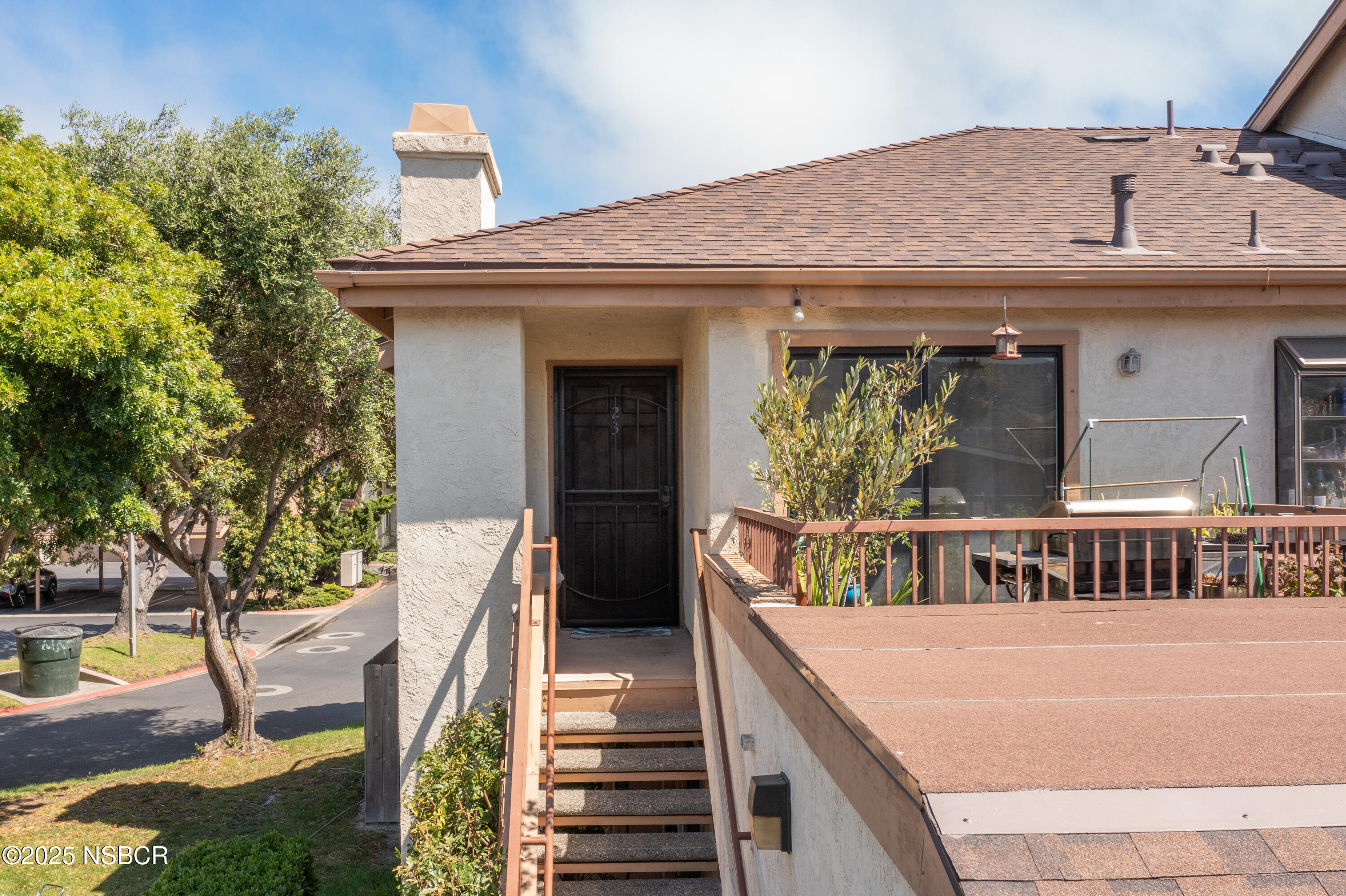 23 Village Cir Drive Lompoc, CA 93436 - Photo 2 of 16 a view of a house with large windows and a small yard
