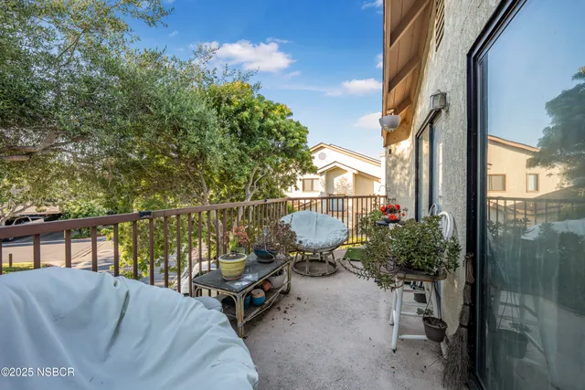 a view of a balcony with chairs