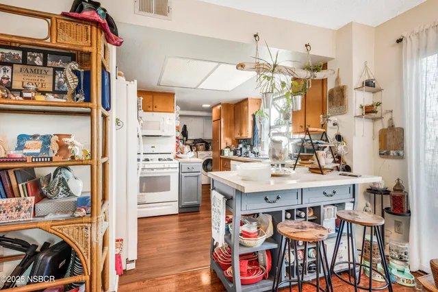 a view of a kitchen and dining table