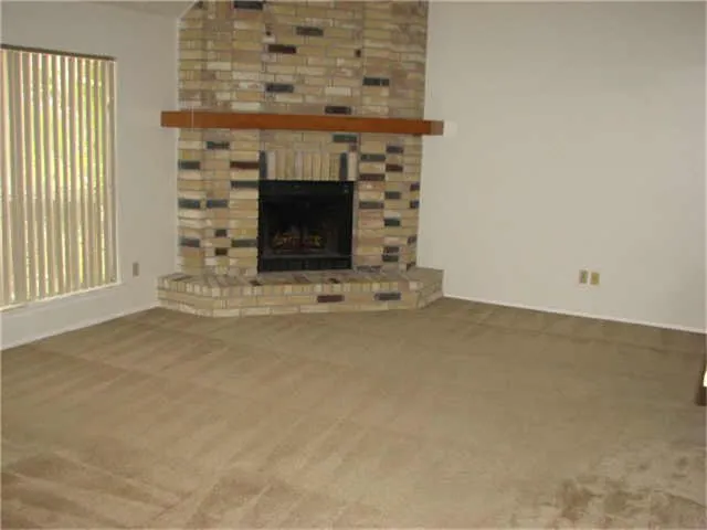 a view of fireplace with a window