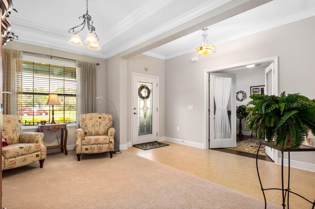To the left of Foyer is a Flex Space which is currently used as an Office with glass doors