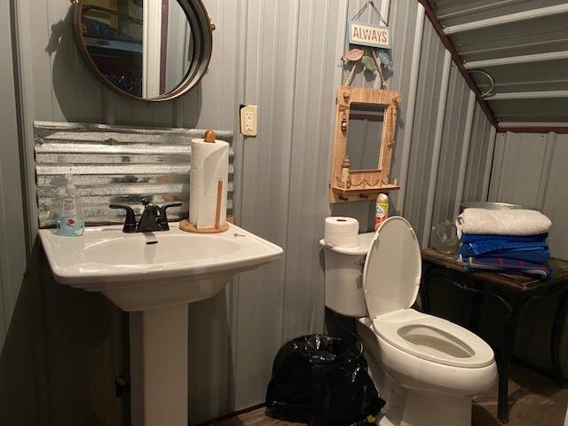 0 Ali Grace Lane Adamsville, TN 38310 - Photo 22 of 27 a bathroom with a sink a toilet and a mirror