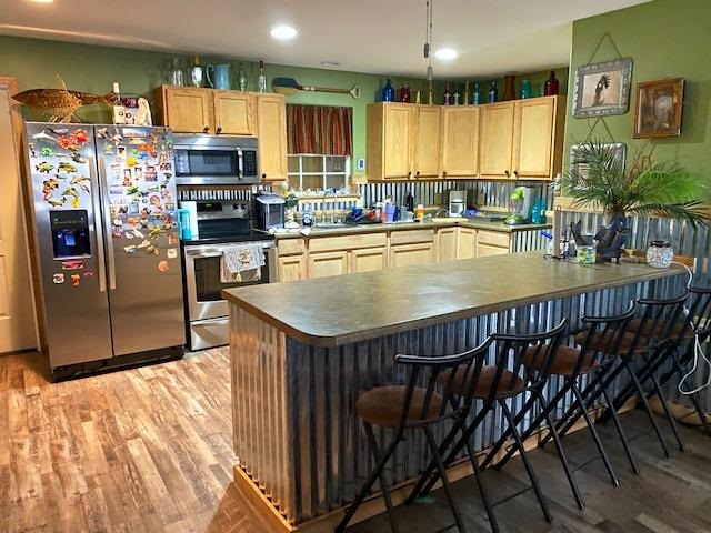 0 Ali Grace Lane Adamsville, TN 38310 - Photo 4 of 27 a kitchen with stainless steel appliances a dining table chairs and a refrigerator