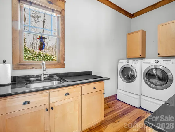 a view of a park with iron fence