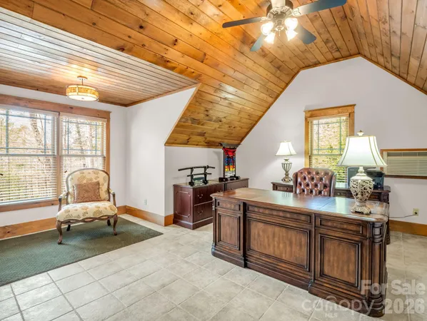 a front view of a house with a yard balcony