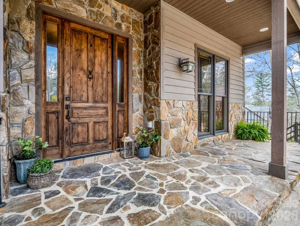 a view of an entryway with wooden floor