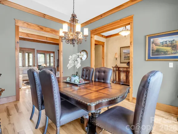 a open kitchen with stainless steel appliances granite countertop a lot of counter space and a dining table