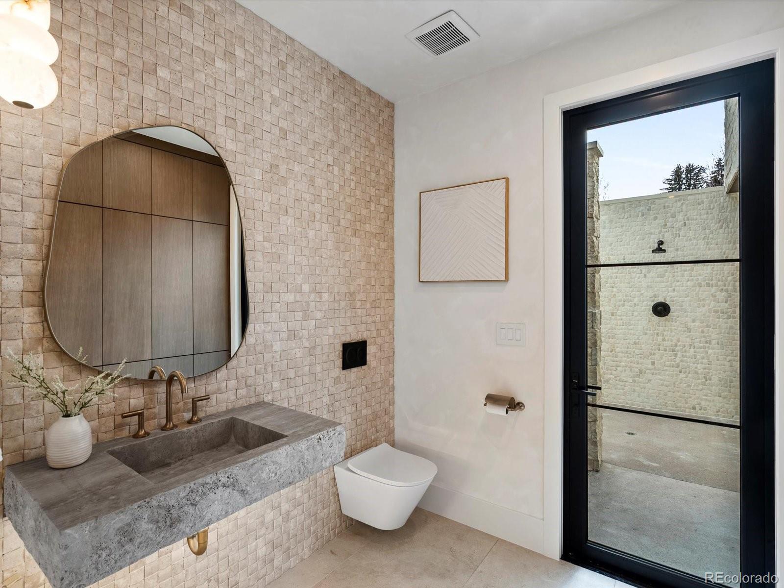 950 South Steele Street Denver, CO 80209 - Photo 19 of 39 a bathroom with a sink and a mirror