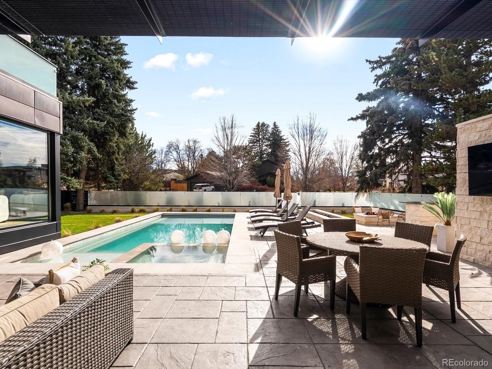 950 South Steele Street Denver, CO 80209 - Photo 20 of 39 a view of a swimming pool with chairs