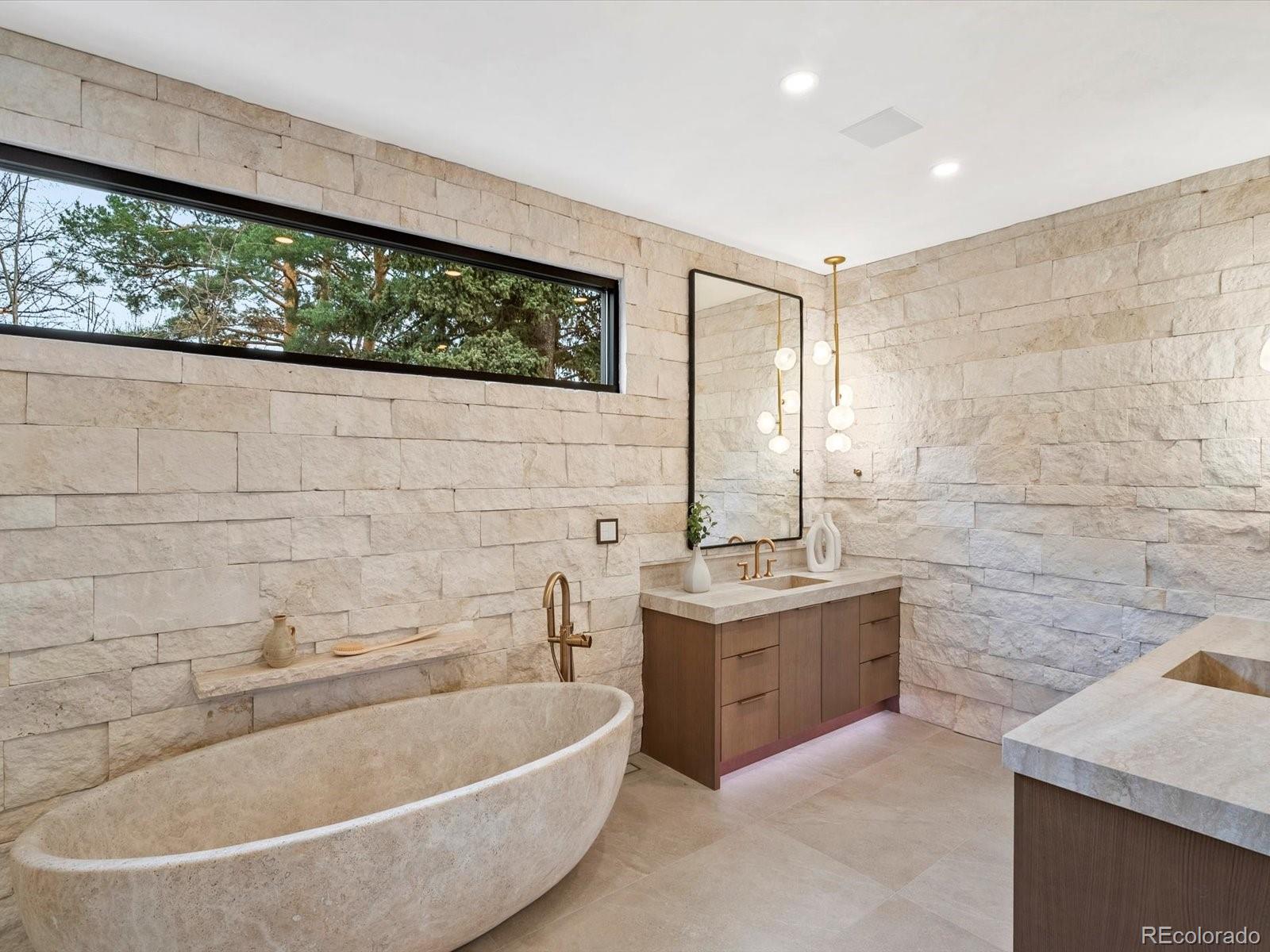 950 South Steele Street Denver, CO 80209 - Photo 23 of 39 a bathroom with a bathtub and sink