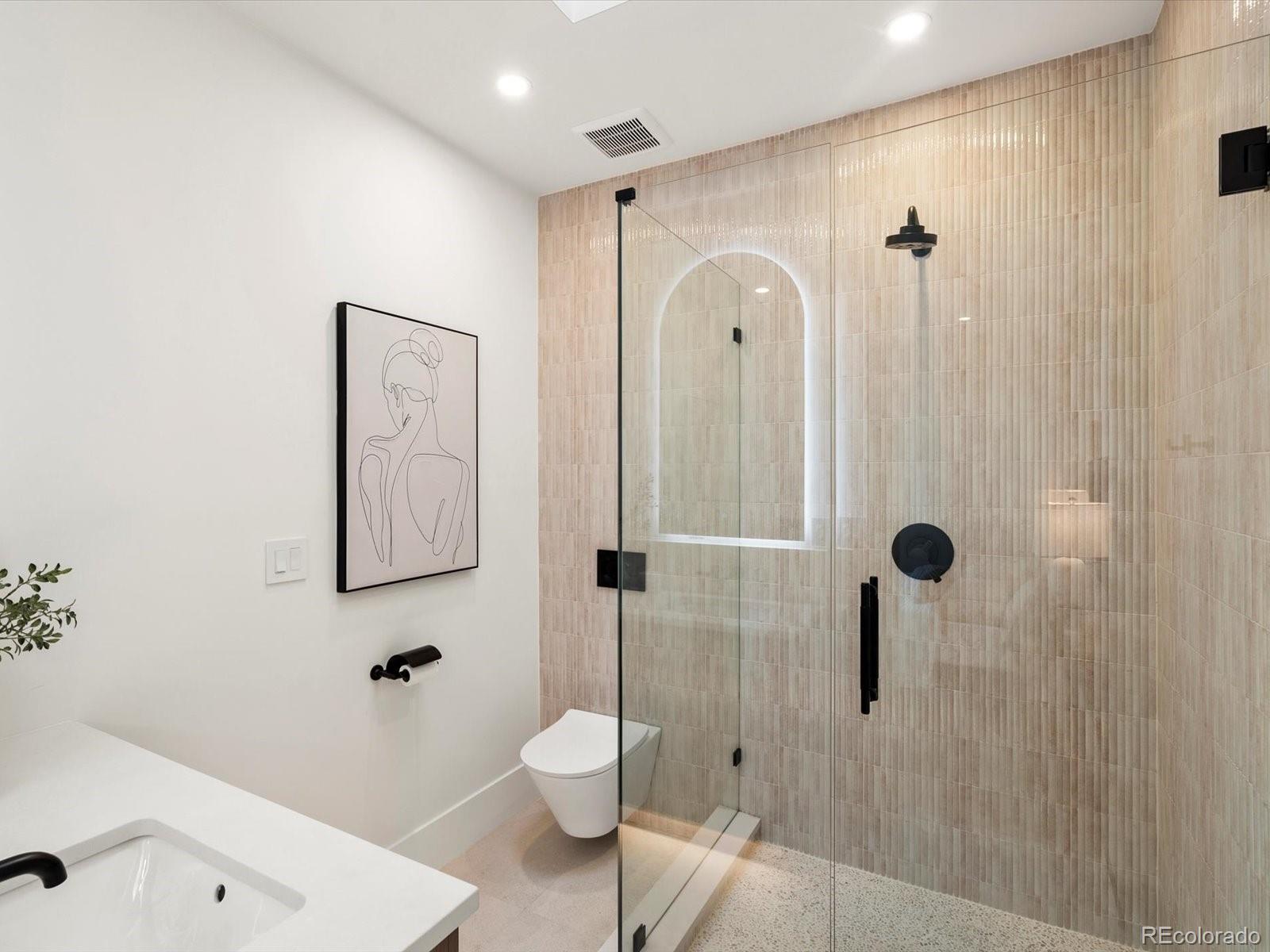 950 South Steele Street Denver, CO 80209 - Photo 27 of 39 a bathroom with a shower toilet and sink