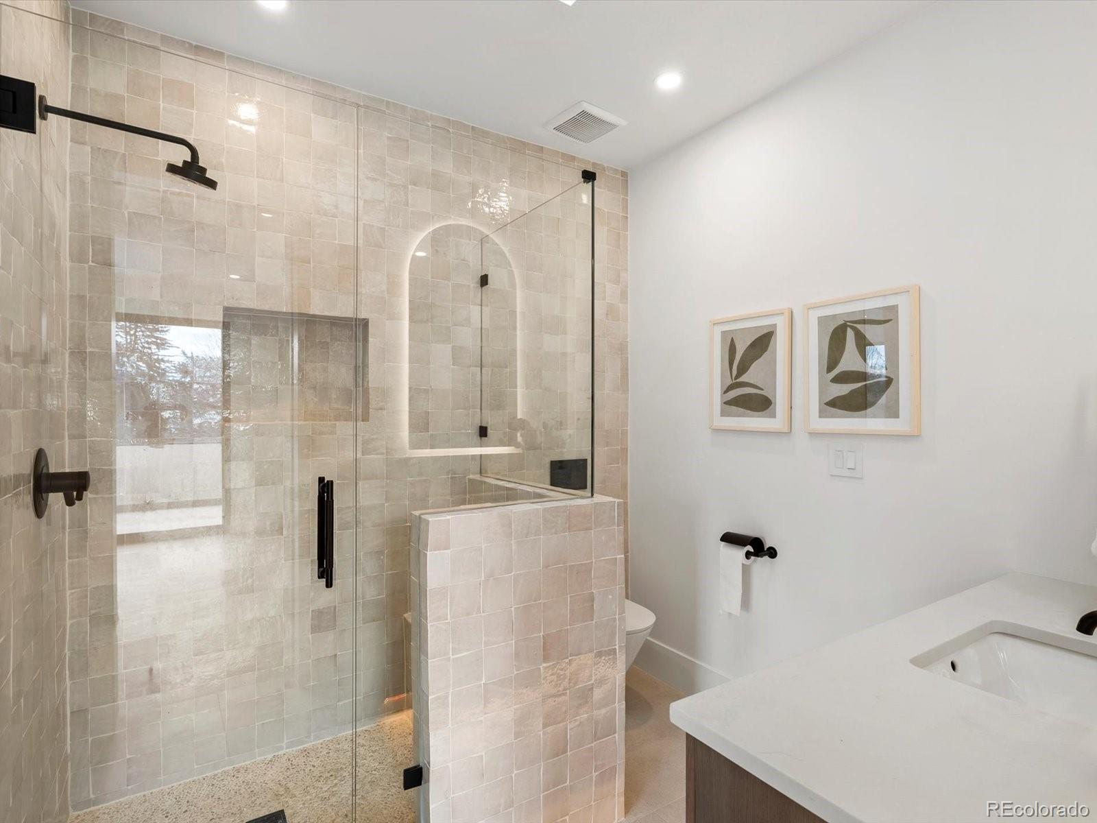 950 South Steele Street Denver, CO 80209 - Photo 29 of 39 a bathroom with a bathtub and a shower