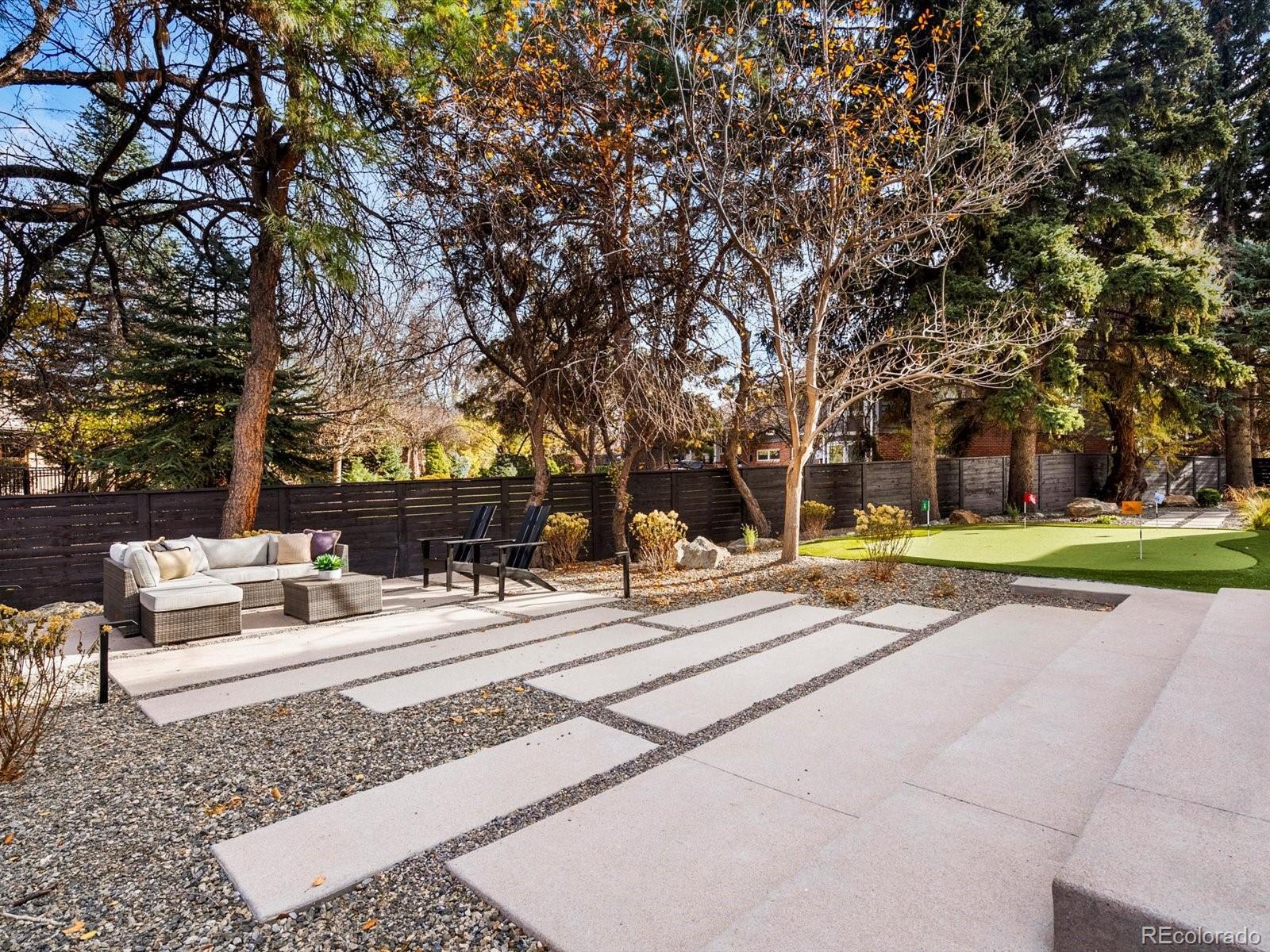 950 South Steele Street Denver, CO 80209 - Photo 38 of 39 a view of a house with a backyard and a tree