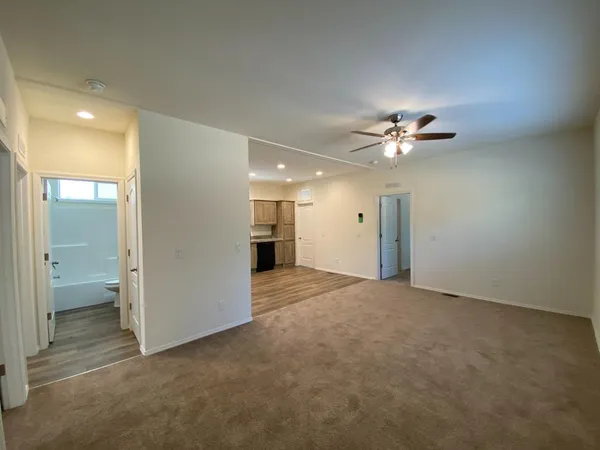 a view of an empty room with a bathroom