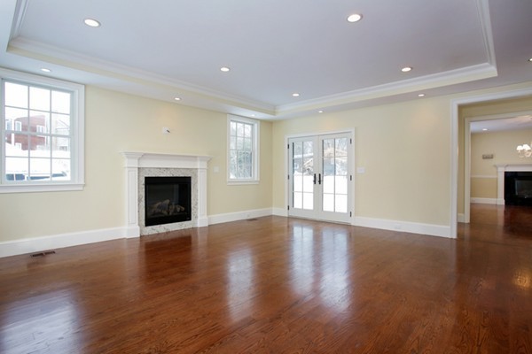 81 Wayne Road Newton, MA 02459 - Photo 4 of 7 a view of an empty room with wooden floor and a window