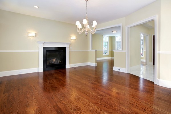81 Wayne Road Newton, MA 02459 - Photo 5 of 7 a view of a livingroom with a fireplace wooden floor and a chandelier