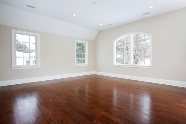 81 Wayne Road Newton, MA 02459 - Photo 6 of 7 an empty room with wooden floor and windows