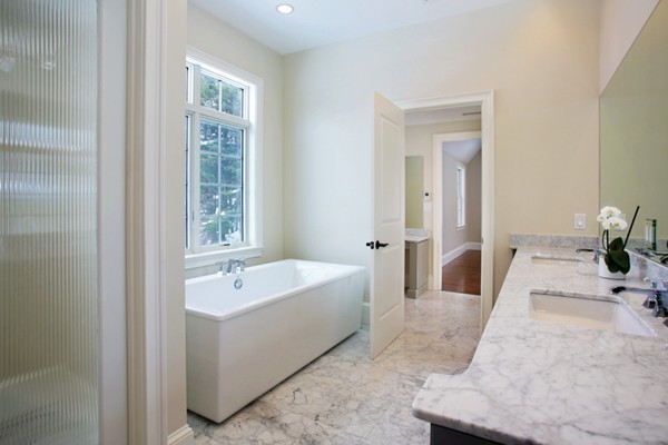 81 Wayne Road Newton, MA 02459 - Photo 7 of 7 a bathroom with a tub sink and mirror
