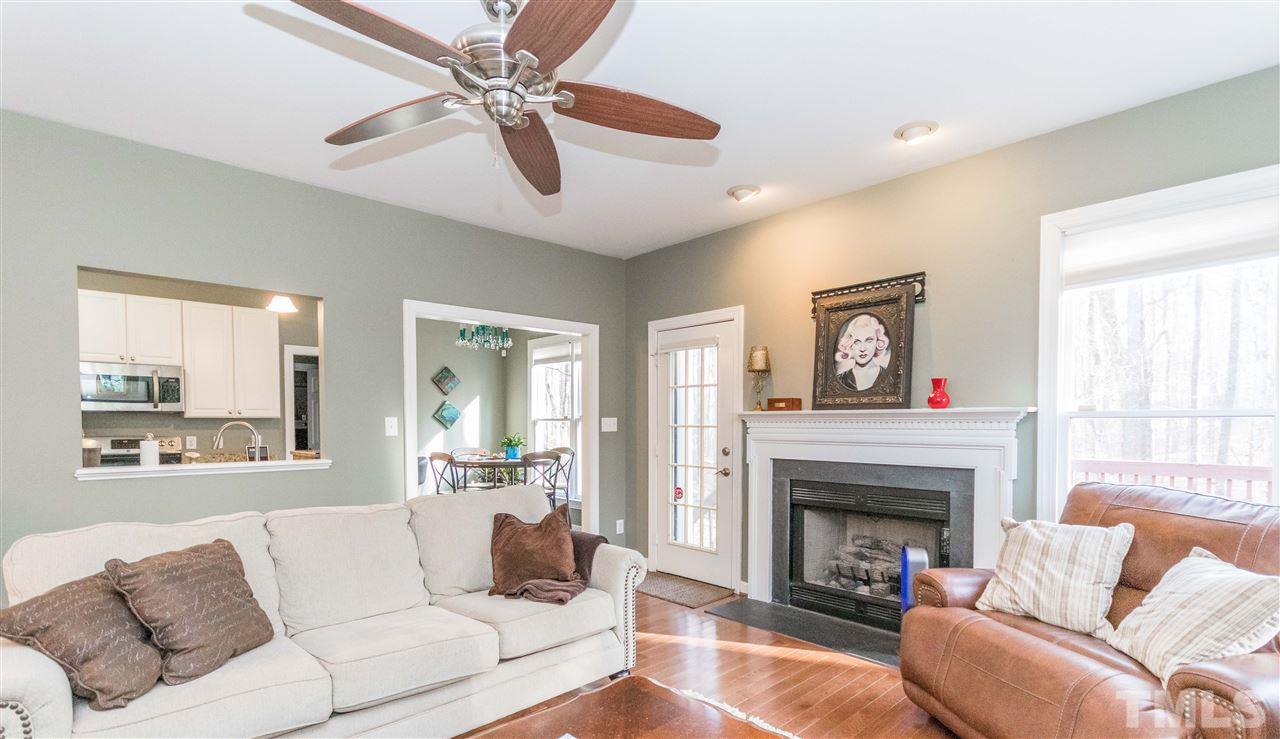 6020 Wild Orchid Trail Raleigh, NC 27613 - Photo 12 of 26 Cozy fireplace with gas logs to keep you toasty on these cold evenings!