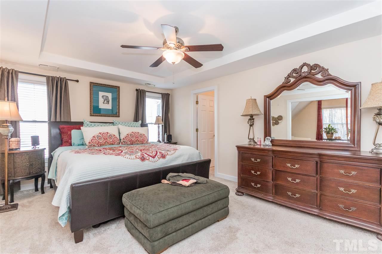 6020 Wild Orchid Trail Raleigh, NC 27613 - Photo 16 of 26 Large Master Bedroom with a tray ceiling, ceiling fan, HUGE master suite and closet!