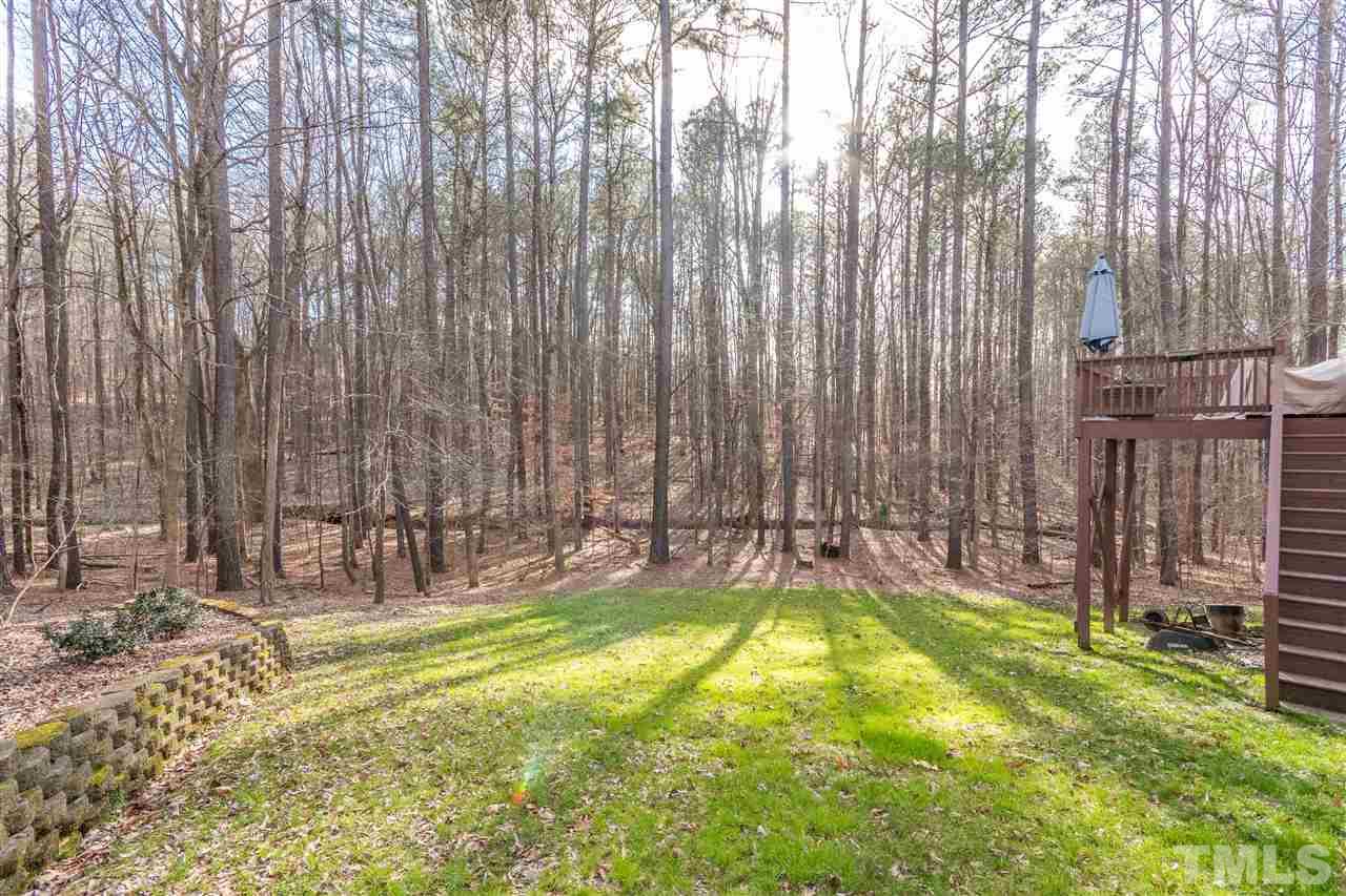 6020 Wild Orchid Trail Raleigh, NC 27613 - Photo 24 of 26 Surrounded by nature! This vacant land behind and beside the home is owned by the HOA and cannot be built on. So it feels like you are living on acres of private woods!
