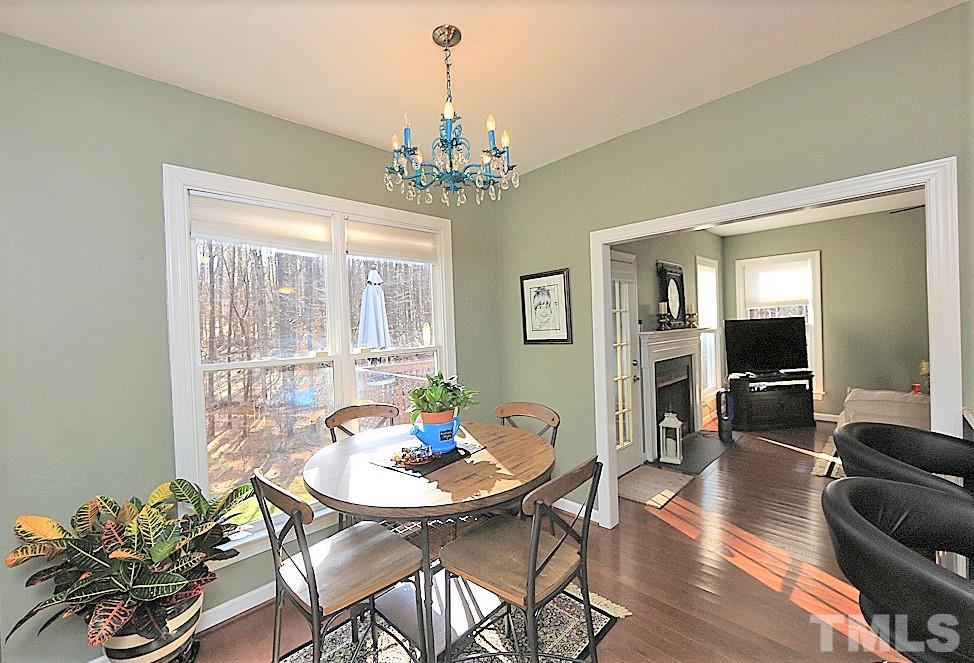 6020 Wild Orchid Trail Raleigh, NC 27613 - Photo 9 of 26 Sunny breakfast nook looking out over a private backyard. Great for nature lovers!